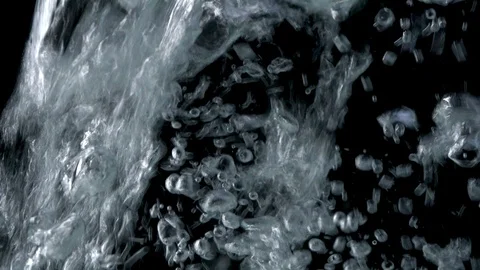 Bubbles rising to the surface on black backgrounds. Slow motion Stock Footage