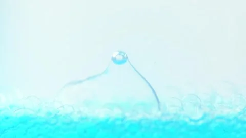 Bubbles rising to the surface. Macro shot of surface level of blue water wi.. Stock Footage 275075671