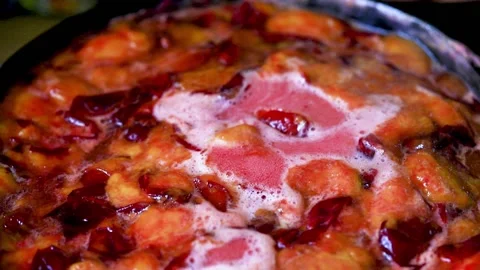 Bubbles rising in thick, red liquid making an abstract background. Macro shot of Stock Footage 138527732