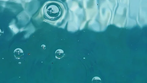 Bubbles rising in water Stock Footage 88882859