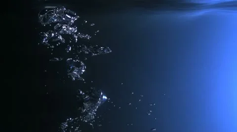 Bubbles rising in water, Slow Motion Stock Footage