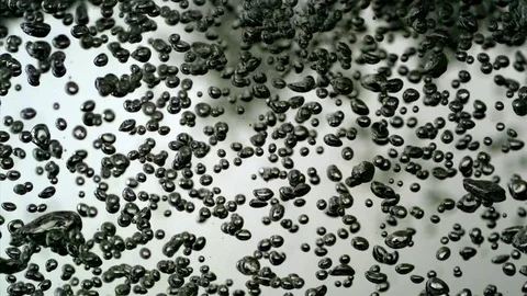 Bubbles rising up in water in slow motion Stock Footage 81230342