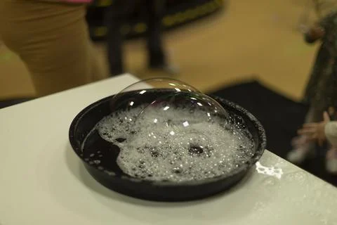 Bubbles. Soap solution for inflatable bubbles. Liquid for entertainment. De.. Stock Photos