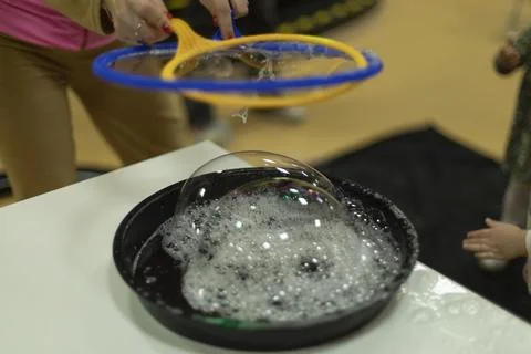 Bubbles. Soap solution for inflatable bubbles. Liquid for entertainment. De.. Stock Photos