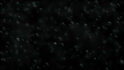 Bubbles of sparkling water move on a black background. Holiday background with Stock Footage 115970958