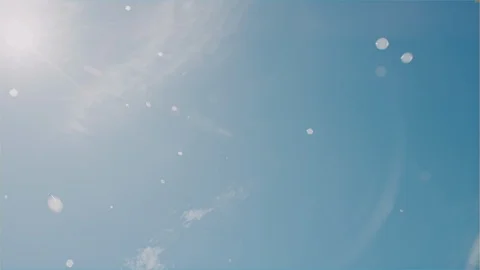 Bubbles in the sun &amp;amp; sky with flares Stock Footage 102632553