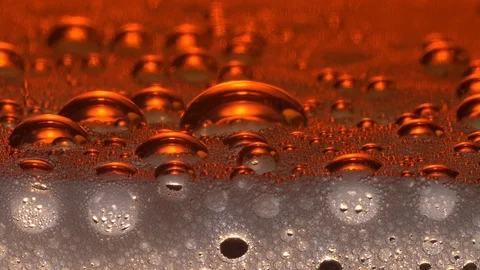Bubbles on the surface of a golden drink Stock Footage 118920501