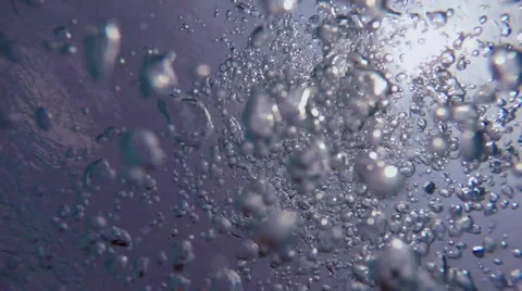 Bubbles Surfacing Against a Blue Sky Stock Footage 50097351