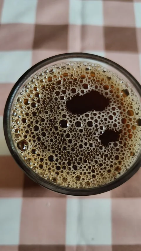 Bubbles on top of coffee drink Stock Footage 289162318