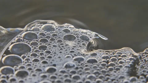 Bubbles under clear ice in stream slide right macro Video stock 150004968
