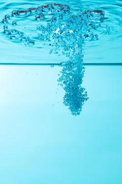 Bubbles under water on blue background Foto stock