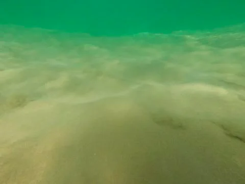 Bubbles under the water of a river Stock Photos