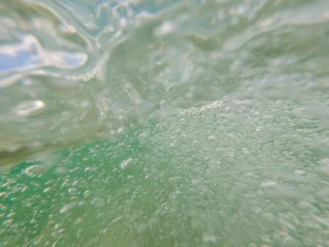 Bubbles under the water of a river Stock Photos