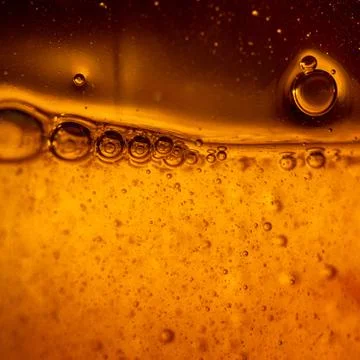 Bubbles under water on yellow Stock Photos