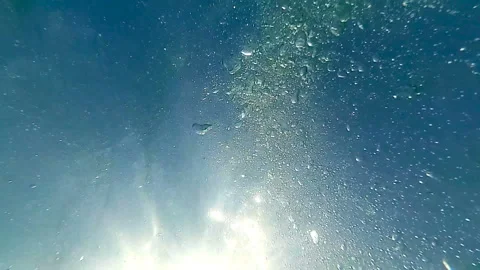 Bubbles underwater against the sun. Stock Footage 94970296