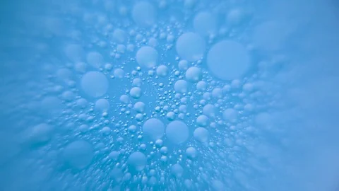 Bubbles in water against blue background Stock Footage 76102770