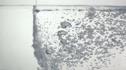 Bubbles into Water against White Background Stock Footage 59725606