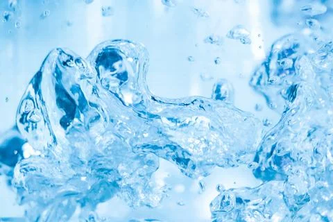 Bubbles in the water close-up. Beautiful splashes of liquid. Stock Photos