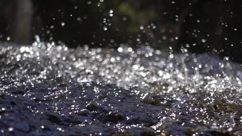 Bubbles of water in a mountain stream. Slow motion footage. Stock Footage 74184384