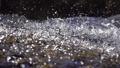 Bubbles of water in a mountain stream. Slow motion footage. Stock Footage 74187966