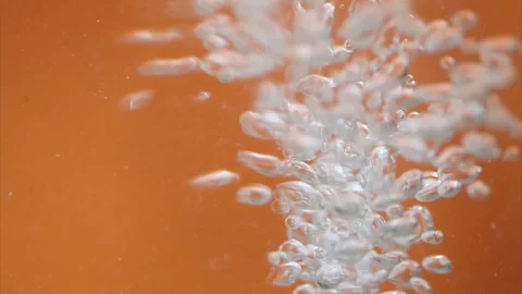 Bubbles in the water , Orange background Stock Footage 113406881