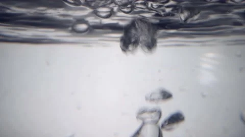 Bubbles in water rising in slow motion 動画素材 156704266