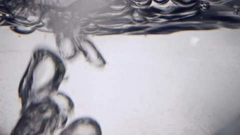 Bubbles in water rising in slow motion Stock Footage 156757188