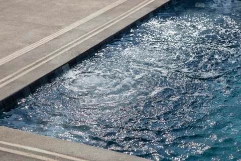Bubbles from working drain in swimming pool Stock Photos