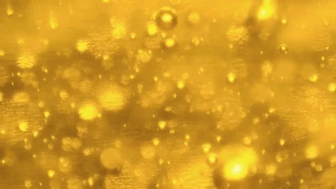Bubbles in a Yellow Liquid  - Macro video Stock Footage 125531159