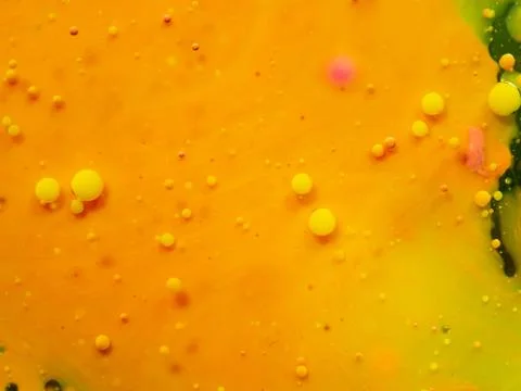 Bubbles on yellow orange background. Close up macro shot. Blurred background Stock Photos