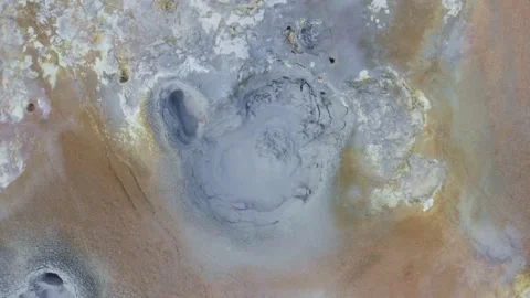 Bubbling and boiling mud pool in Myvatn in Iceland, dolly out shot Stock Footage 138737594