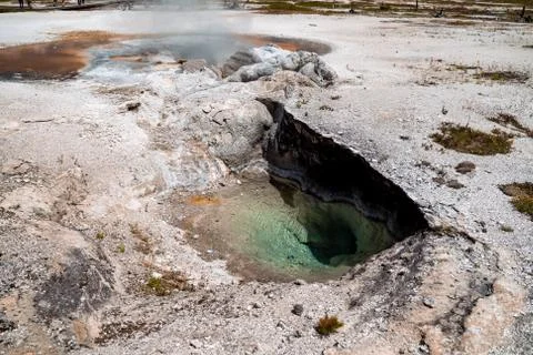 Bubbling and steaming Avoca Spring in Biscuit Basin area of Yellowstone Natio Stock Photos