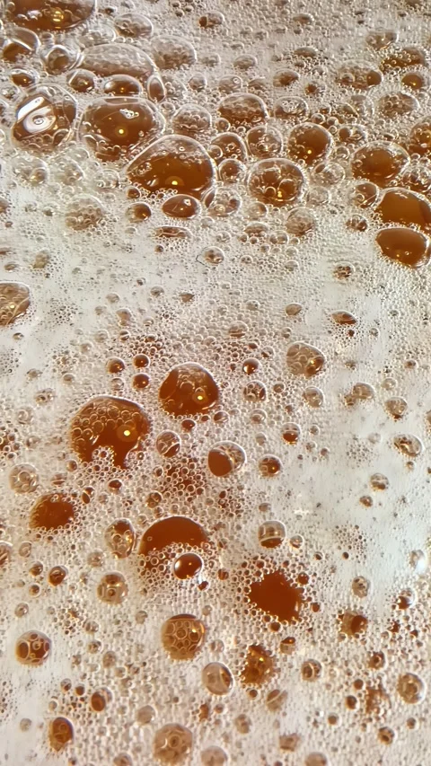 Bubbling beer foam close up texture Stock Footage 336297267