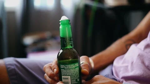 Bubbling beer in green bottle. Stock Footage 235551801