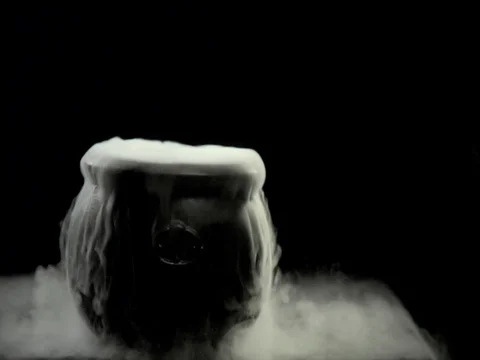 Bubbling black cauldron on a black backdrop with room for graphics Video stock 84571638