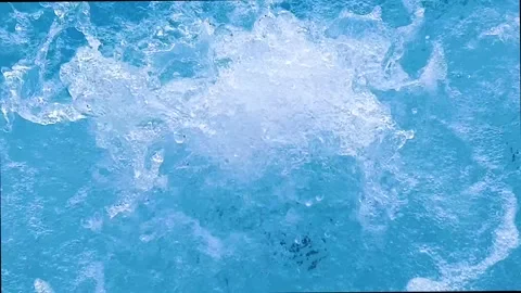 Bubbling blue water creating white foam and splashes Stock Footage 330007557