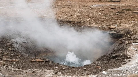 Bubbling boiling steaming water underground spring Stock Footage 112044603