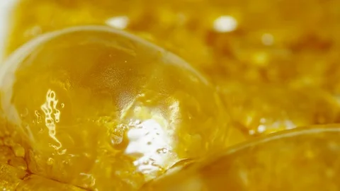 Bubbling cannabis concentrate Stock Footage
