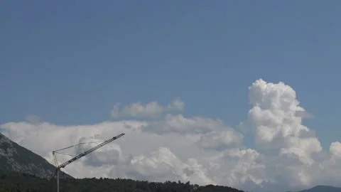 Bubbling cloud formations behind a construction crane timelapse Stock Footage 159079436