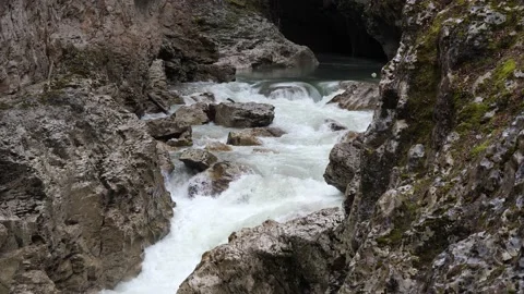 Bubbling flow of a mountain river in a rocky gorge, 2x slow motion Stock Footage 168185414