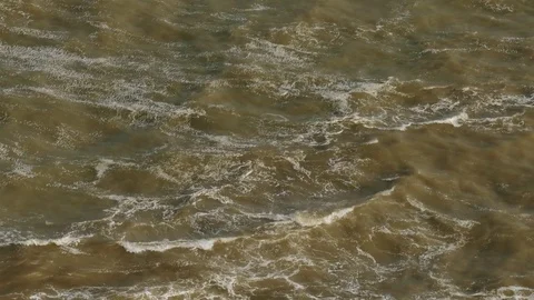 Bubbling flows of dirty water Stock Footage 80430321