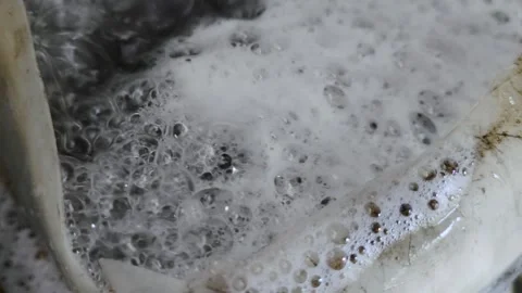 Bubbling Foam in Soapy Liquid with Textural Details Stock Footage 307930593