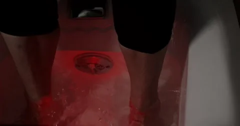 Bubbling Foot Bath with Red Light and Sparkling Water at Spa, High Angle Shot Stock Footage 340203039
