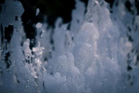 Bubbling fountain splashes Stock Photos