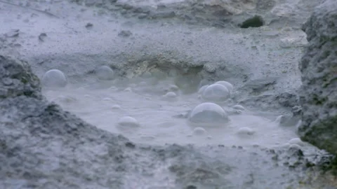 Bubbling geothermal mud pot boiling in Iceland Stock Footage 330269247