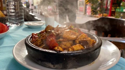 Bubbling hot Salmon dish is served in a restaurant of Istanbul, Turkey 4K Stock Footage 166172257