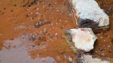 Bubbling hot spring thermal volcanic water in Natural Reserve of Caldeira Velha Stock Footage 265174710