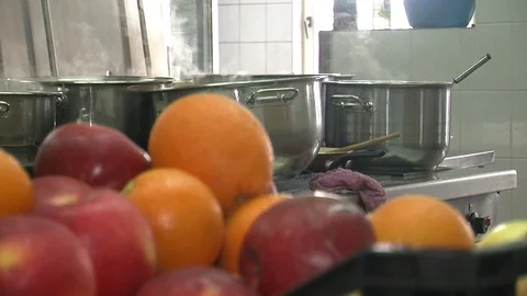 Bubbling meat soup, inside a metal pot, at a restaurant kitchen 動画素材 90227157