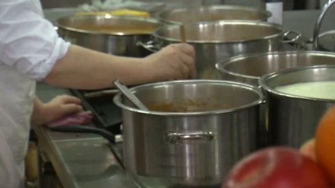 Bubbling meat soup, inside a metal pot, at a restaurant kitchen Stock Footage 90227486