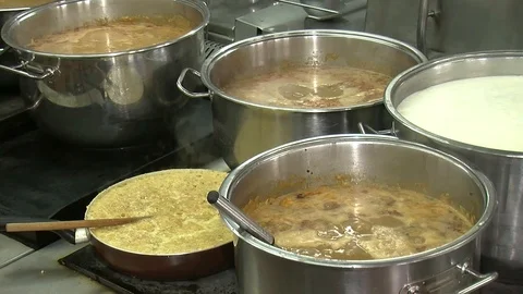 Bubbling meat soup, inside a metal pot, at a restaurant kitchen 動画素材 90227992